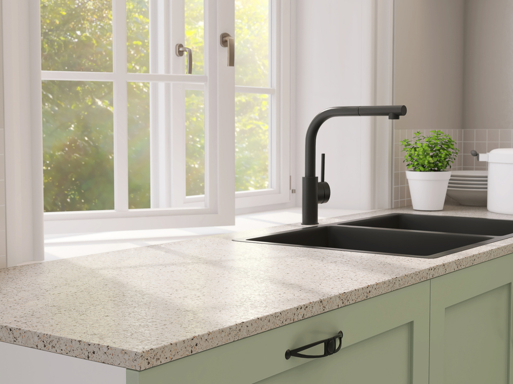 Minimal-and-contemporary-green-kitchen-counter-with-granite-top-and-black-quartz-sink-with
